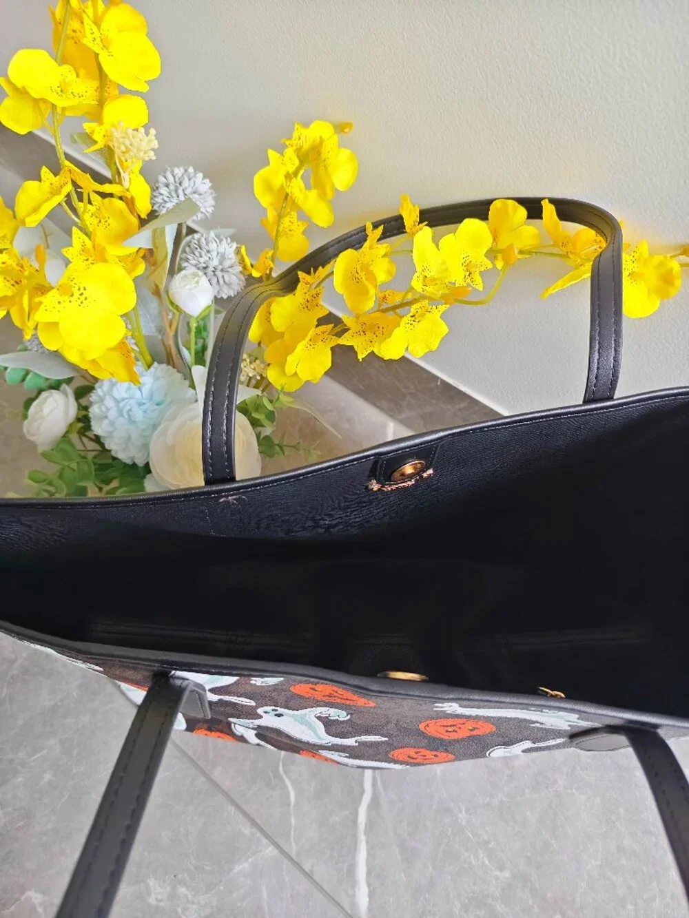 Coach tote featuring